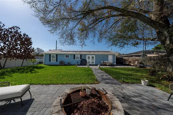 a front view of a house with a garden and pathway