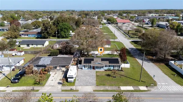 an aerial view of a house with a garden