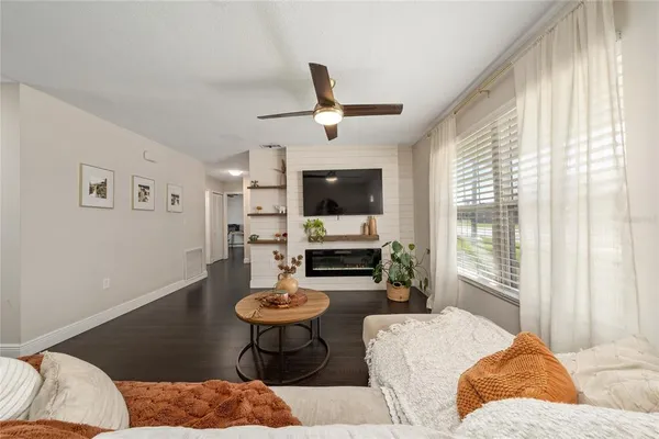 a living room with furniture and a large window