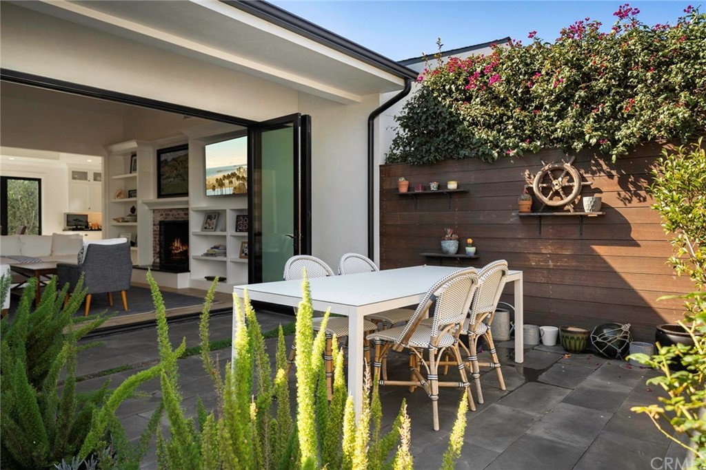 277 Knox Place Costa Mesa, CA 92627 - Photo 11 of 21 a patio with table and chairs