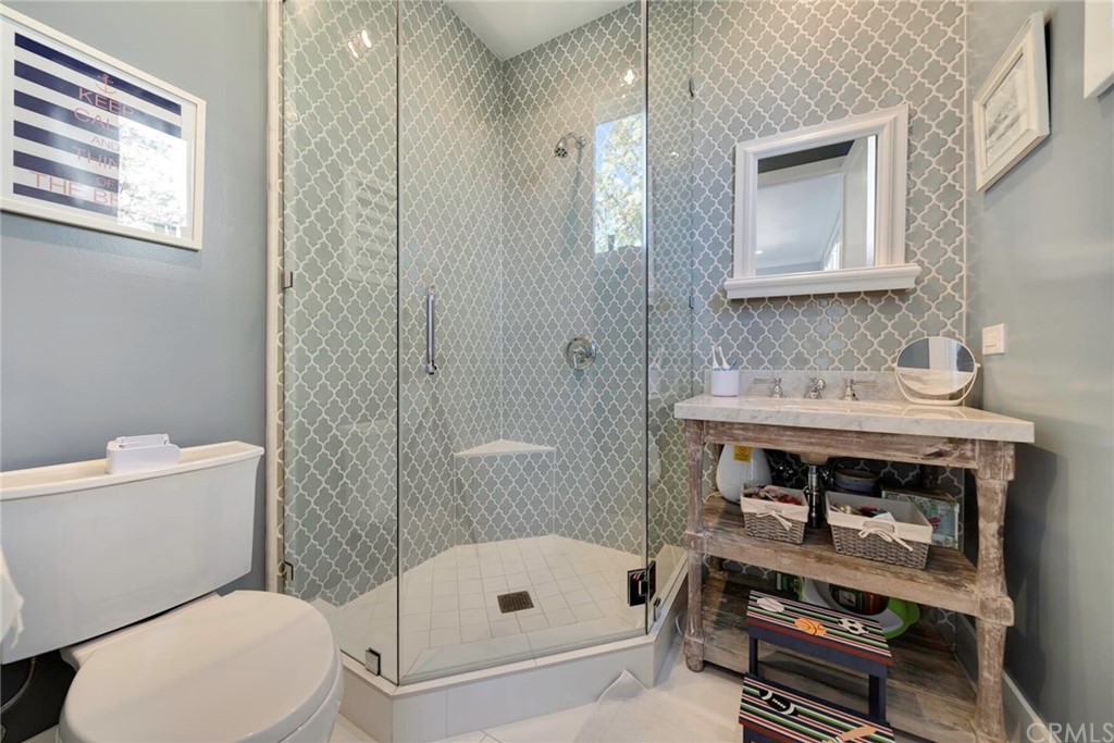 277 Knox Place Costa Mesa, CA 92627 - Photo 14 of 21 a bathroom with a sink a toilet and shower