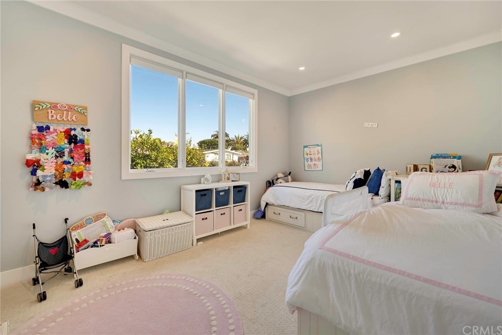 277 Knox Place Costa Mesa, CA 92627 - Photo 17 of 21 a bed room with a bed and a couch