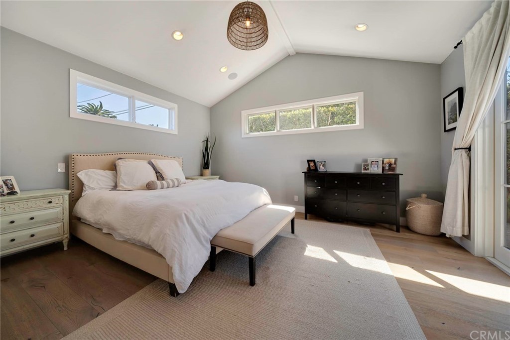 277 Knox Place Costa Mesa, CA 92627 - Photo 19 of 21 a bedroom with a bed and a lamp on dresser
