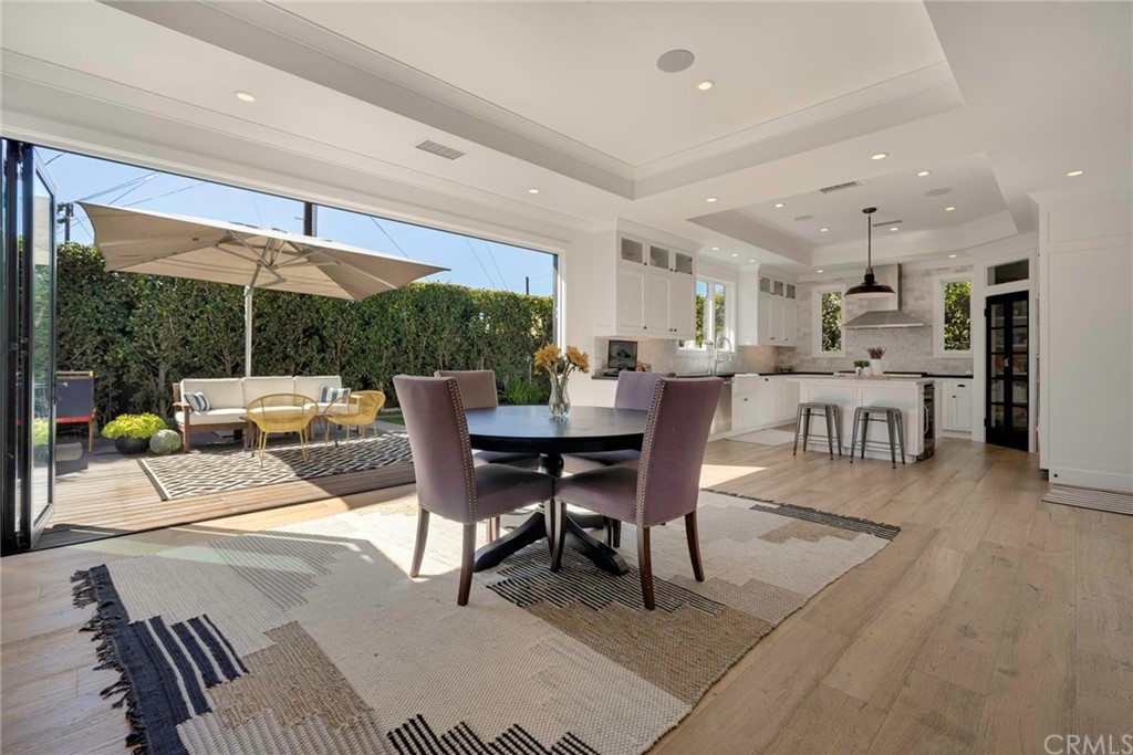 277 Knox Place Costa Mesa, CA 92627 - Photo 5 of 21 a view of a dining room with furniture and chandelier