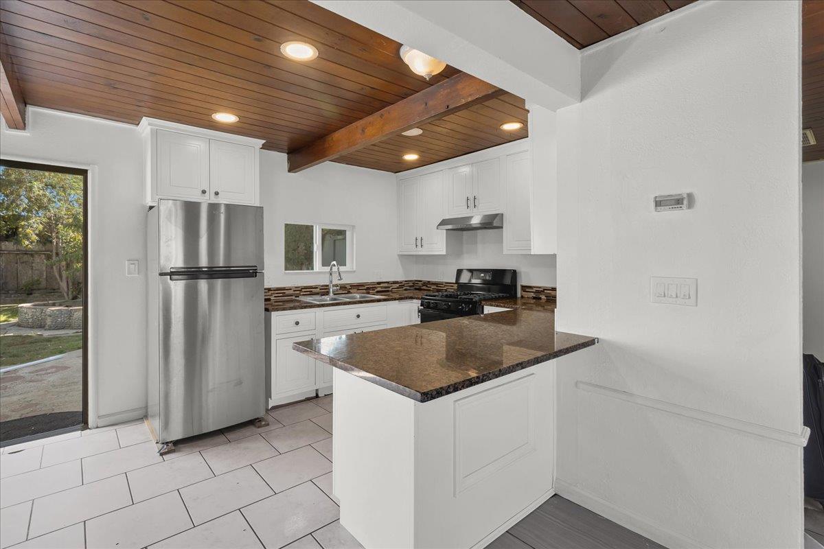 1238 Granada Avenue Salinas, CA 93906 - Photo 12 of 36 a kitchen with stainless steel appliances granite countertop a refrigerator and a stove