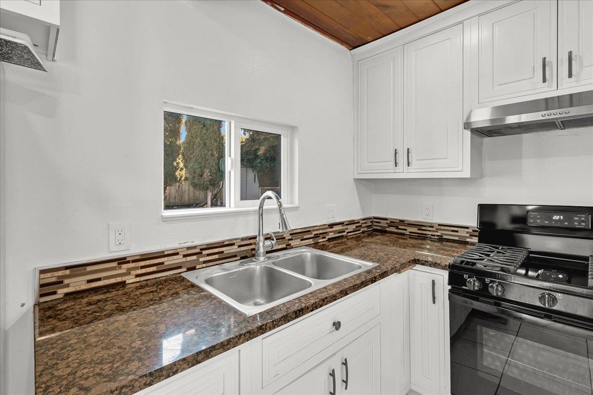 1238 Granada Avenue Salinas, CA 93906 - Photo 14 of 36 a kitchen that has a sink and a stove