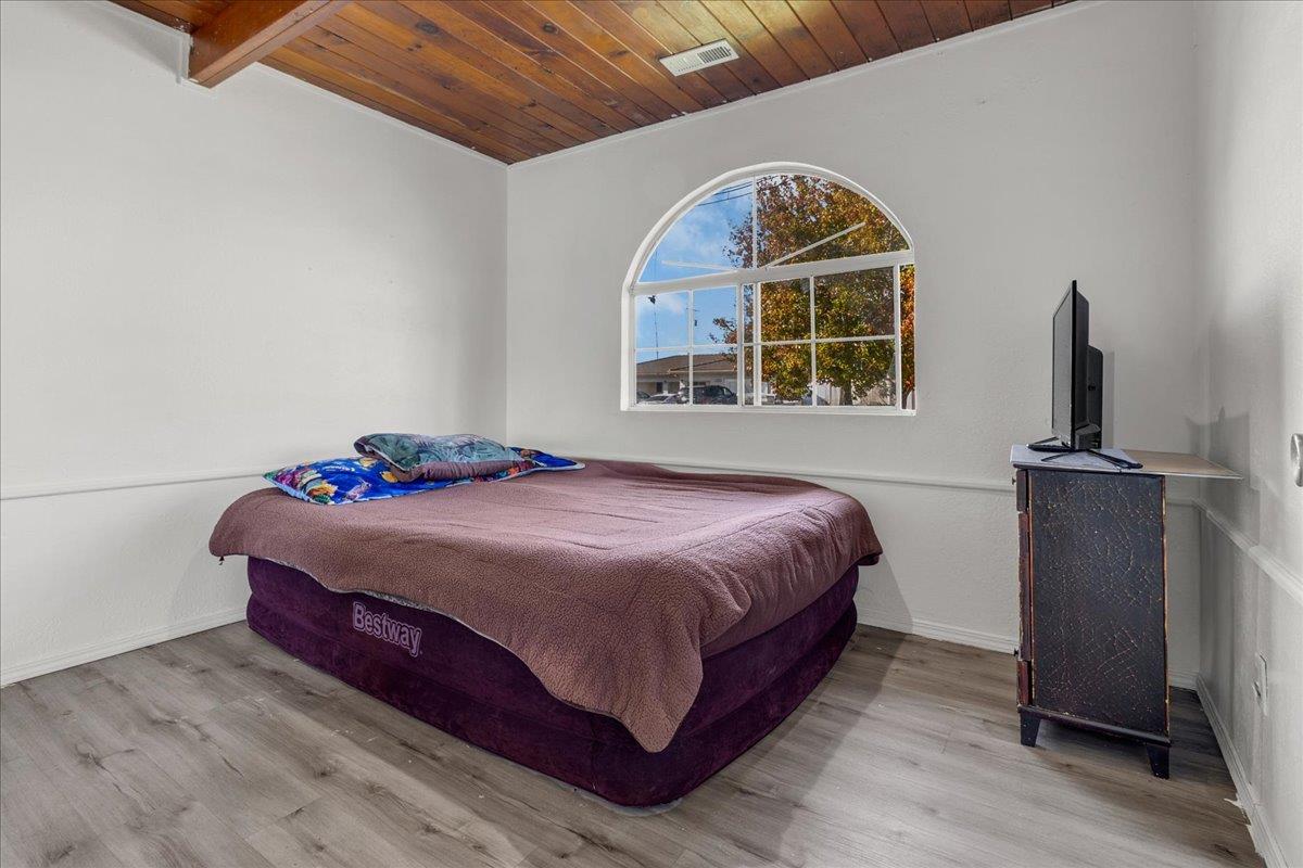 1238 Granada Avenue Salinas, CA 93906 - Photo 16 of 36 a bedroom with a bed and a window