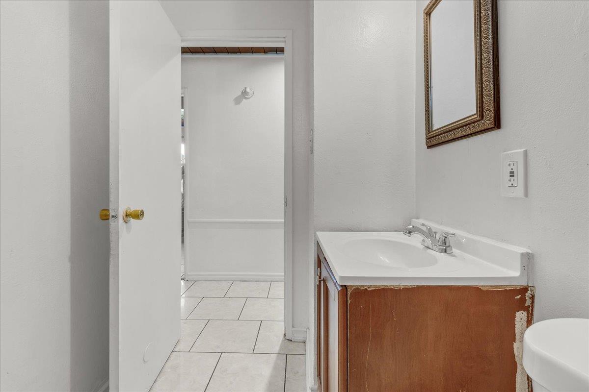 1238 Granada Avenue Salinas, CA 93906 - Photo 21 of 36 a bathroom with a sink and mirror