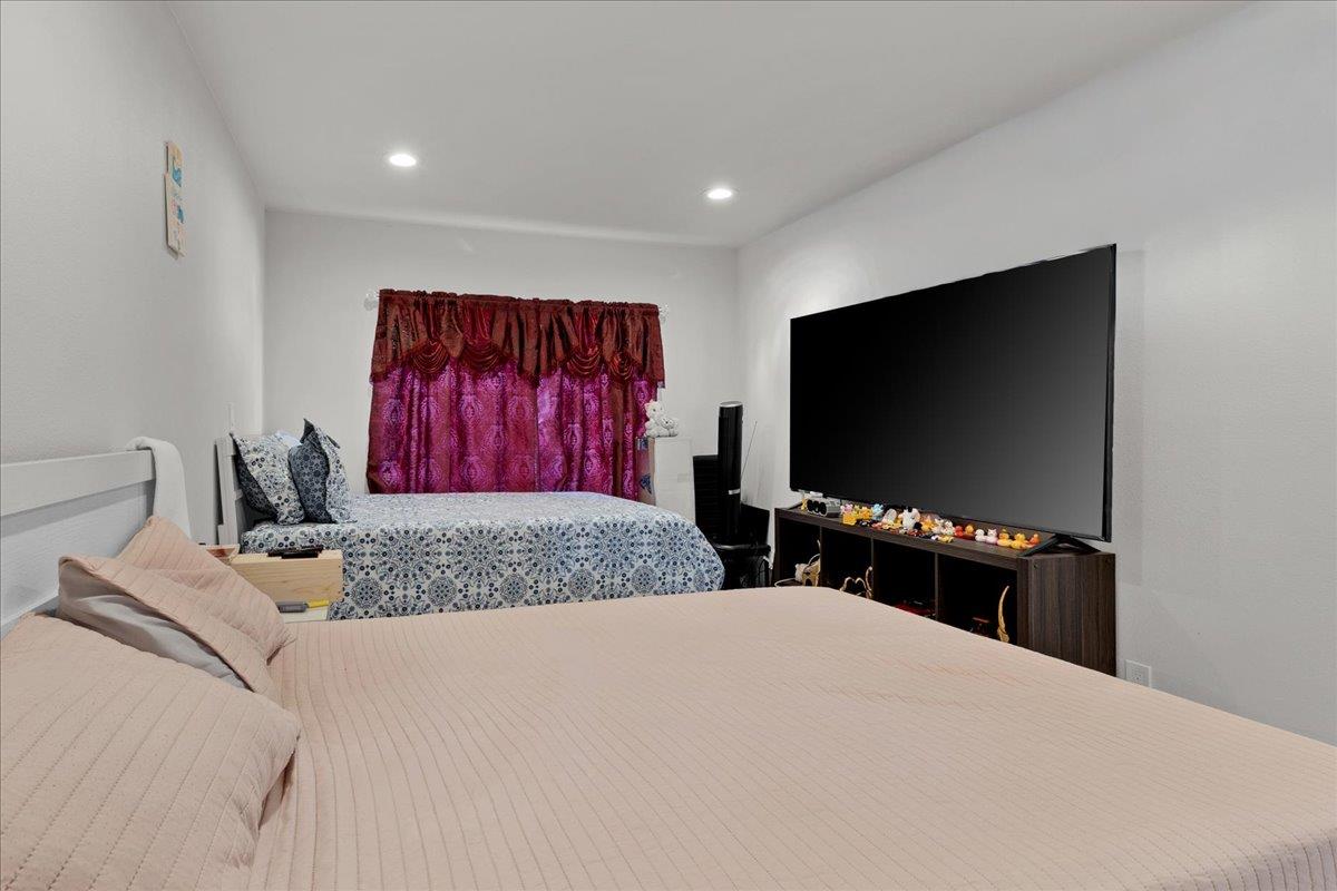 1238 Granada Avenue Salinas, CA 93906 - Photo 29 of 36 a bedroom with a bed and a flat screen tv