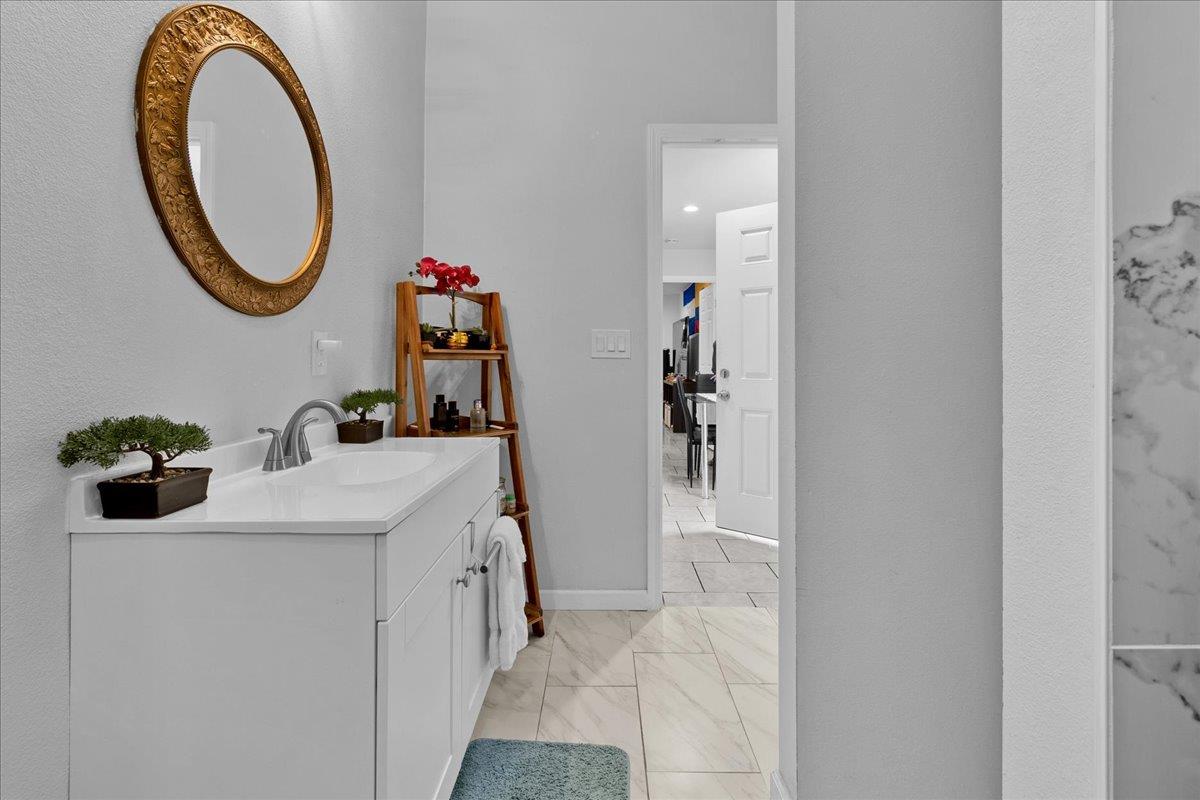 1238 Granada Avenue Salinas, CA 93906 - Photo 33 of 36 a bathroom with a sink and a mirror
