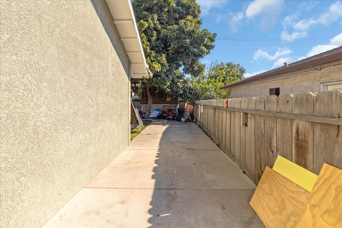 1238 Granada Avenue Salinas, CA 93906 - Photo 36 of 36 a view of a patio with couches and table and chairs with wooden fence