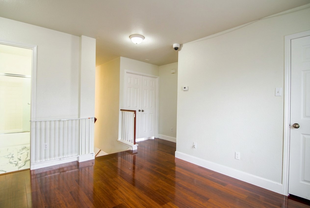 1431 Roxanne's Run Pflugerville, TX 78660 - Photo 14 of 29 Spare room with dark wood-style floors and baseboards