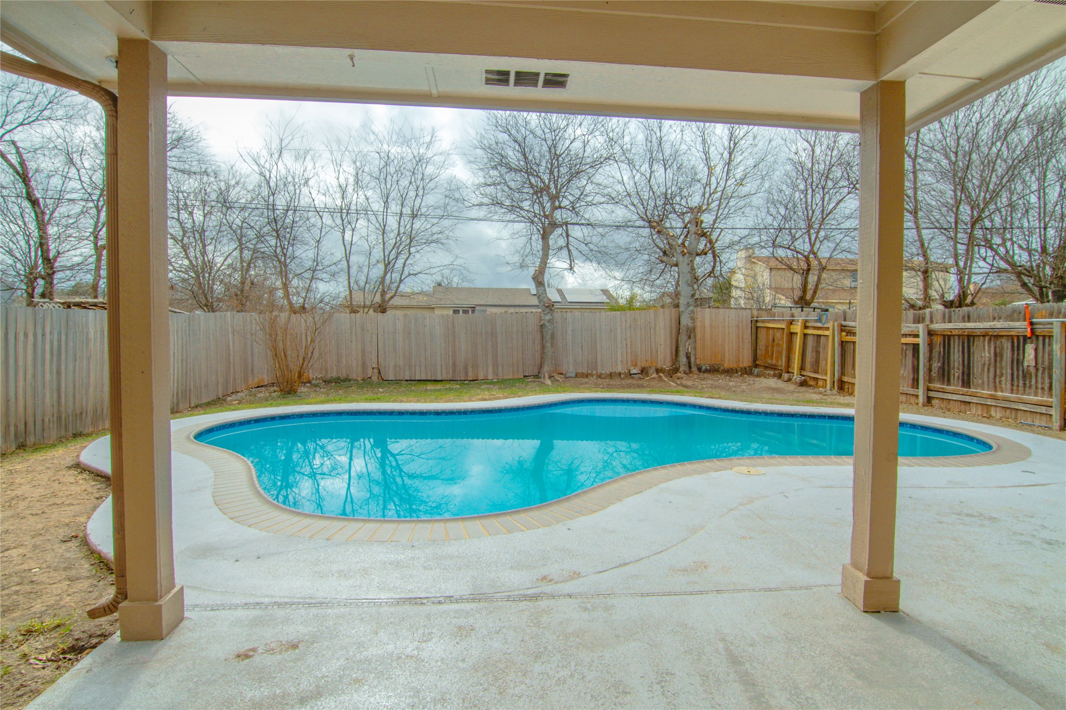 1431 Roxanne's Run Pflugerville, TX 78660 - Photo 26 of 29 View of pool featuring a fenced backyard and patio surround