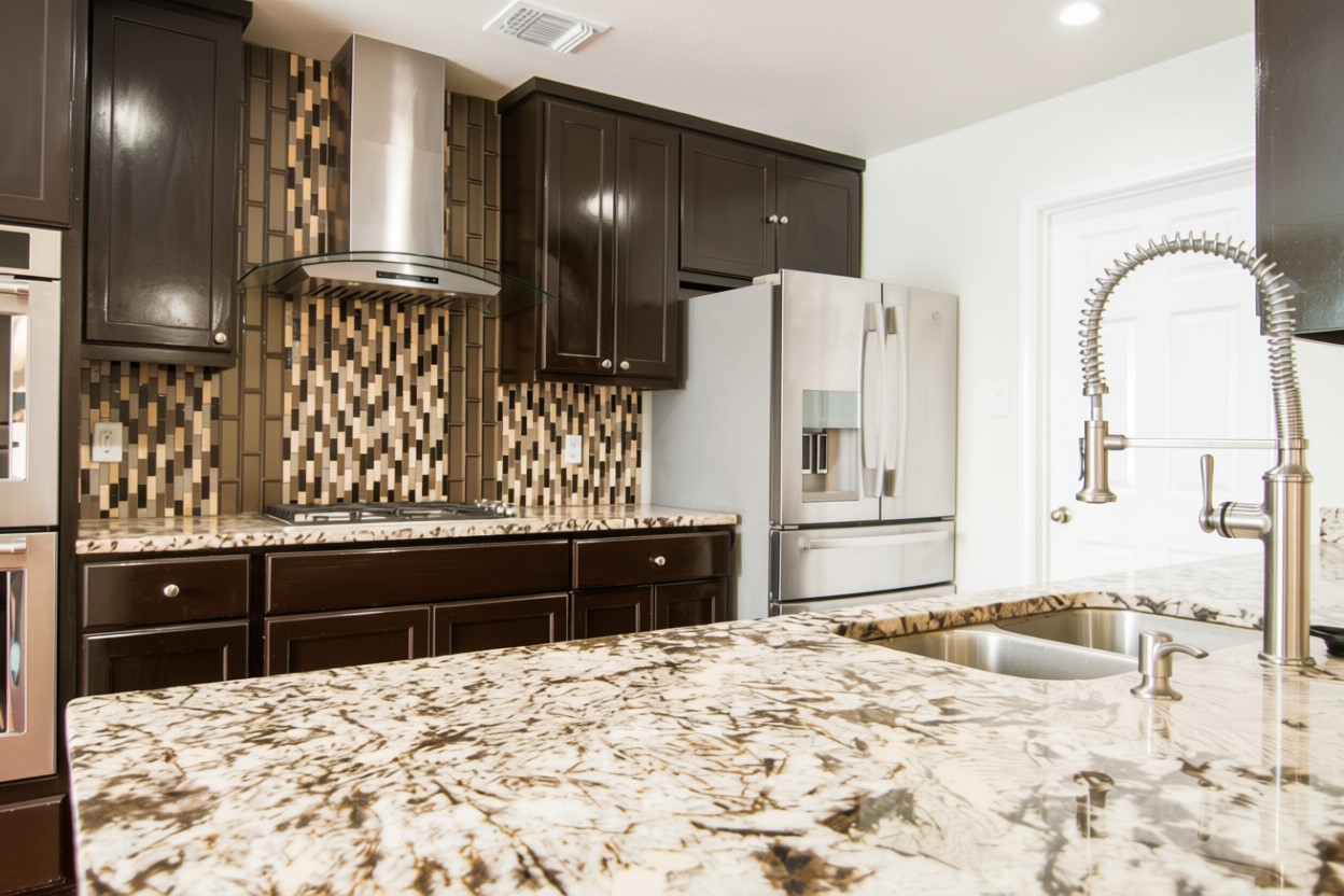 1431 Roxanne's Run Pflugerville, TX 78660 - Photo 10 of 29 Kitchen featuring light stone counters, stainless steel fridge, tasteful backsplash, dark wood finish cabinets, and recessed lighting