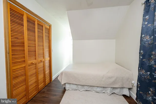 a large white bed in a small room