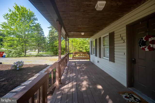 a view of a swimming pool with a patio