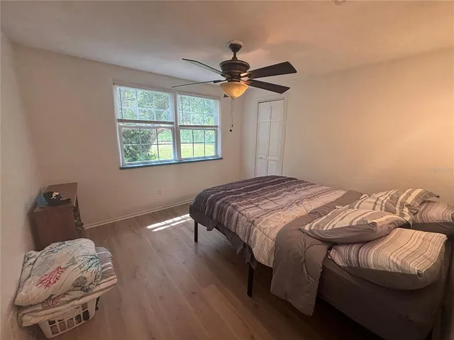 a bedroom with a bed and a window