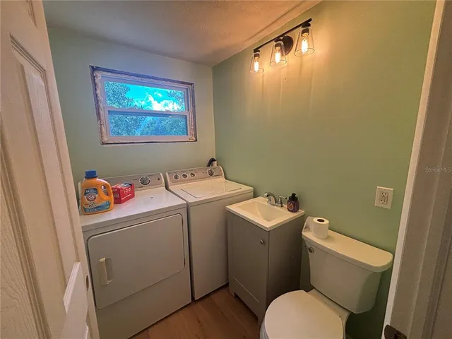 a bathroom with a toilet and a sink