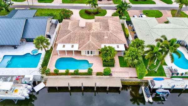 an aerial view of a chairs and table in the patio