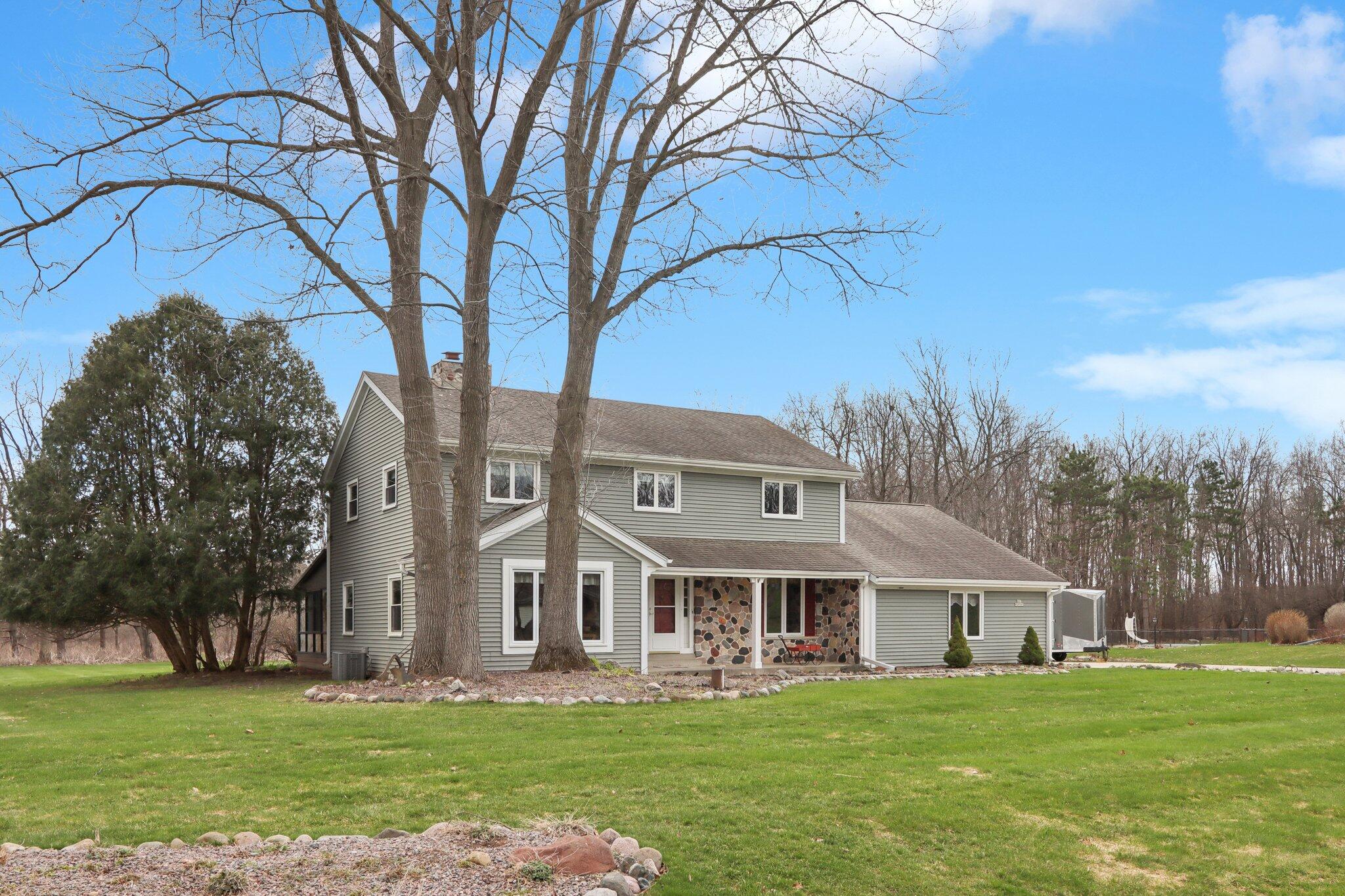 To Woodfield Village with mature trees and walking trails.