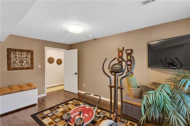 a bathroom with a sink mirror and toilet