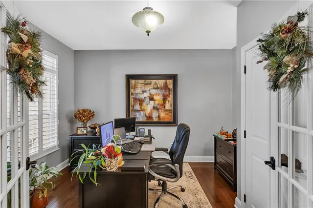 a workspace with furniture and a potted plant