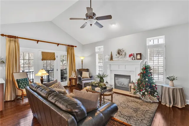 a living room with furniture fireplace and window