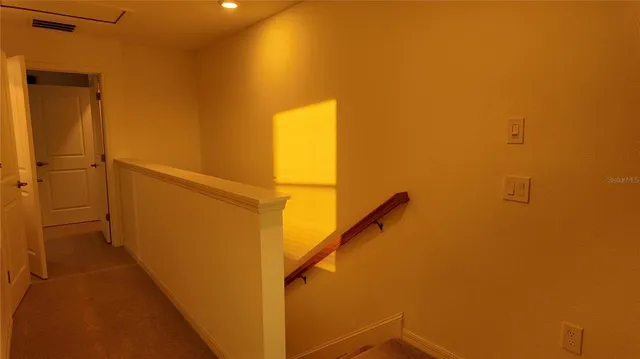 a view of hallway with stairs