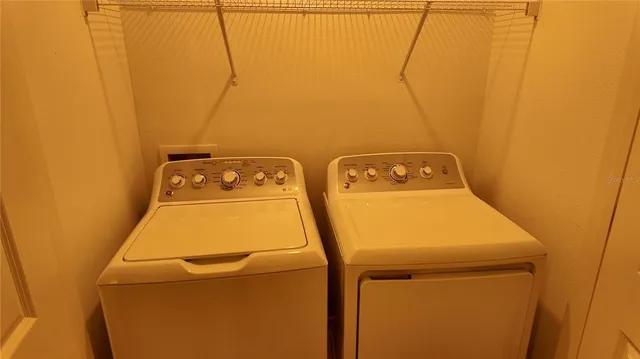 a utility room with dryer and washer