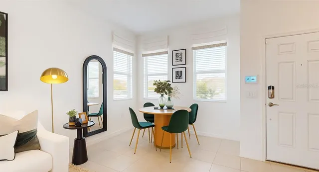 a dining room with furniture and window