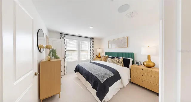 a bedroom with a bed and window