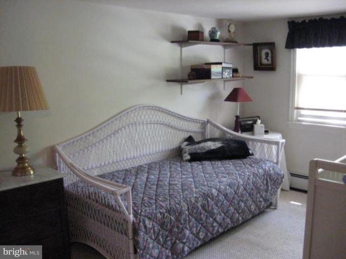 2805 Harford Road Fallston, MD 21047 - Photo 5 of 9 a bedroom with a bed and a window