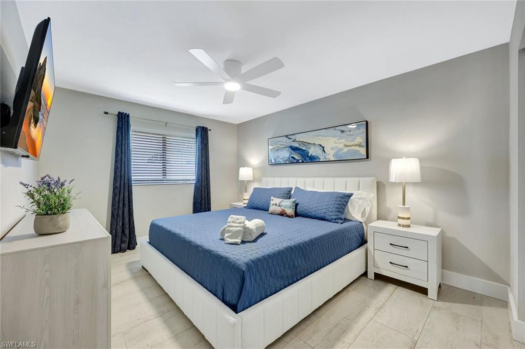 761 99th Avenue North Naples, FL 34108 - Photo 12 of 31 Bedroom featuring baseboards and ceiling fan