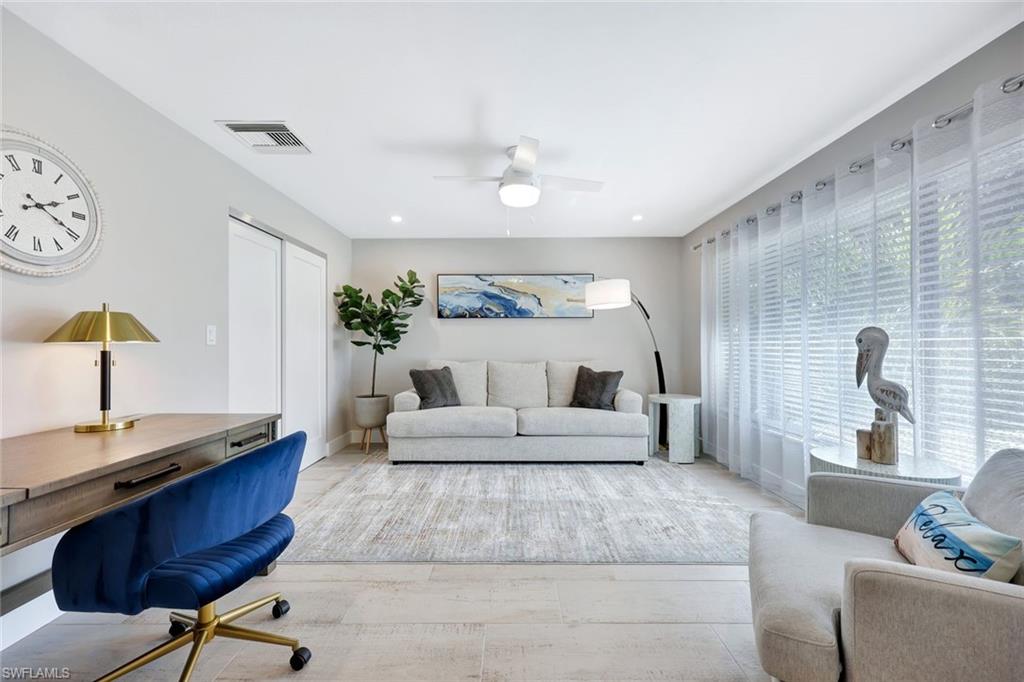 761 99th Avenue North Naples, FL 34108 - Photo 14 of 31 Living room with a ceiling fan and recessed lighting