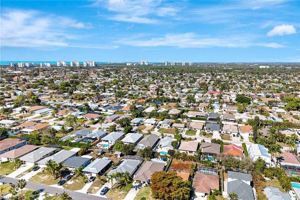 761 99th Avenue North Naples, FL 34108 - Photo 25 of 31 Aerial overview of property's location with nearby urban area and nearby suburban area