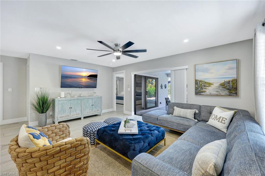 761 99th Avenue North Naples, FL 34108 - Photo 7 of 31 Living area with a ceiling fan, wood finished floors, and recessed lighting