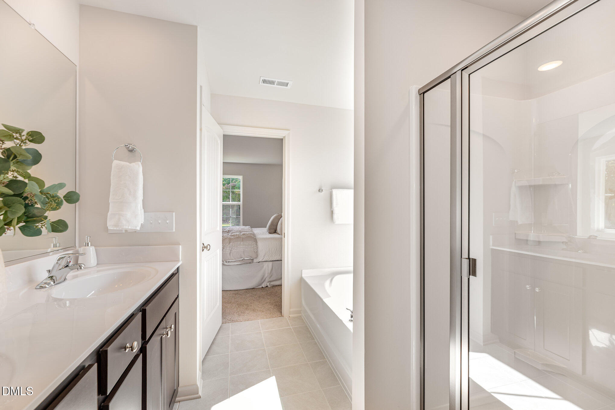 2302 Broad Street Durham, NC 27704 - Photo 11 of 16 a bathroom with a sink a toilet and a mirror