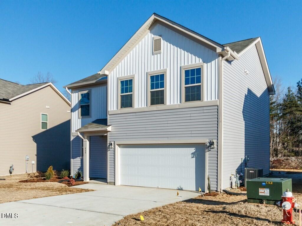 2302 Broad Street Durham, NC 27704 - Photo 2 of 16 a front view of a house with a garage