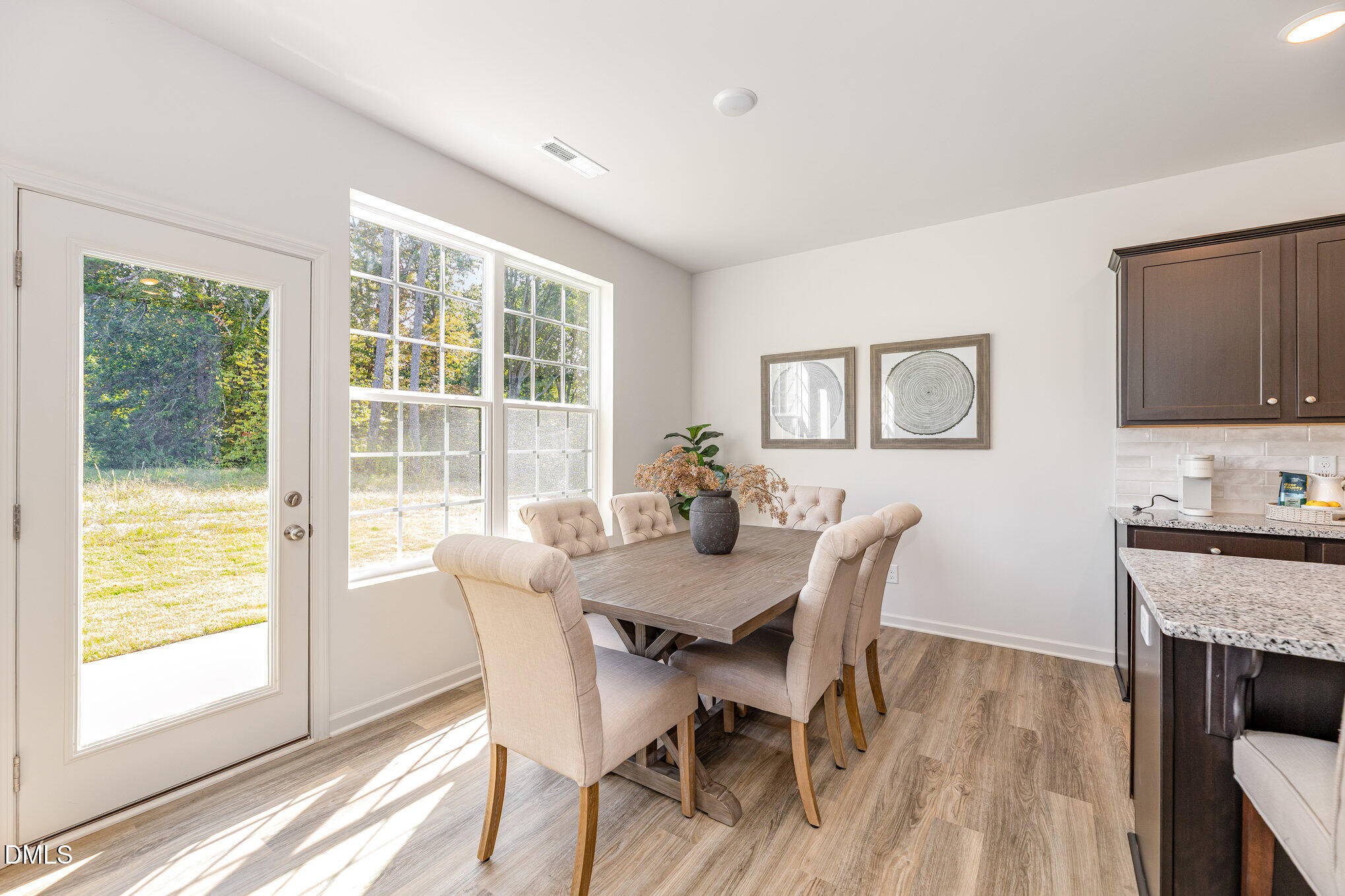2302 Broad Street Durham, NC 27704 - Photo 5 of 16 a view of a dining room with furniture window and wooden floor