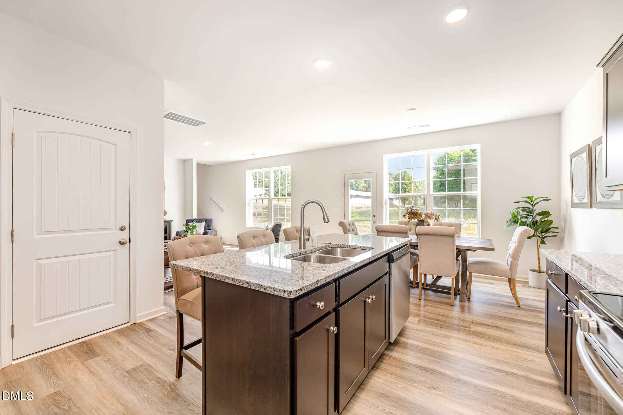 2302 Broad Street Durham, NC 27704 - Photo 6 of 16 a very nice looking dining room with kitchen island a sink and a large window