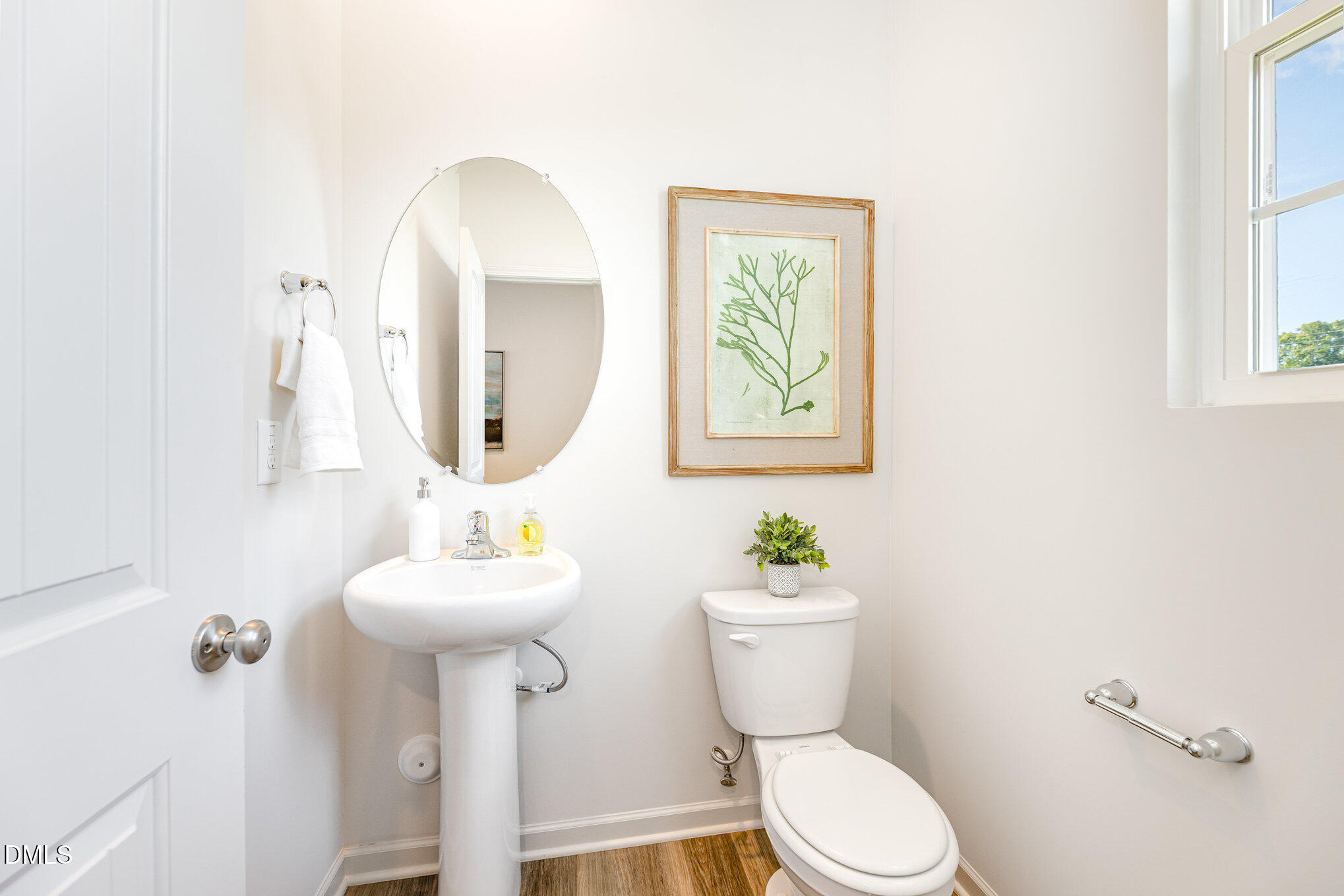 2302 Broad Street Durham, NC 27704 - Photo 8 of 16 a bathroom with a toilet sink and mirror
