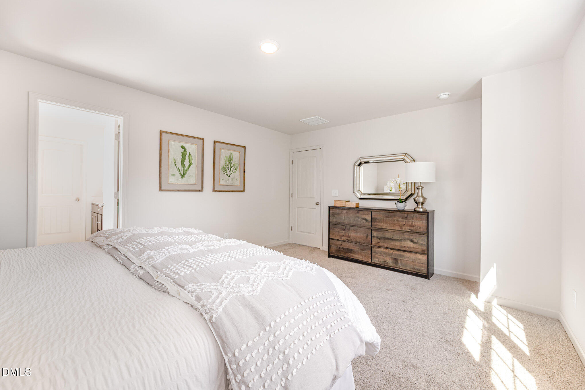 2302 Broad Street Durham, NC 27704 - Photo 9 of 16 a bedroom with a bed and dresser