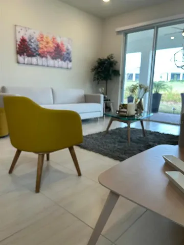 a bedroom with a bed dresser and a window