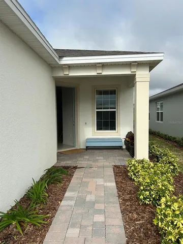 a view of a house with a large window