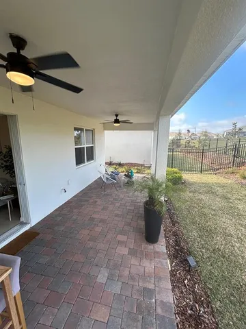 a living room with a sink furniture and a mirror