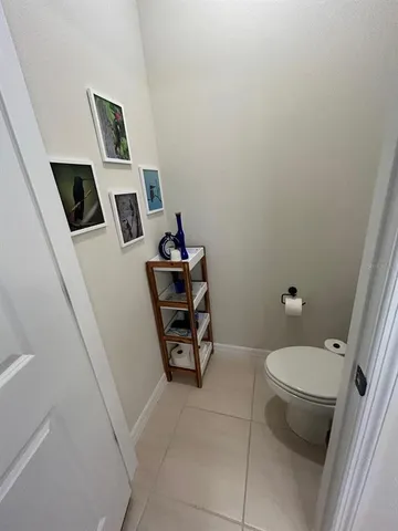 a bathroom with a toilet and a sink