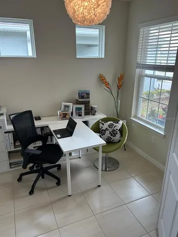 a workspace with furniture and a window