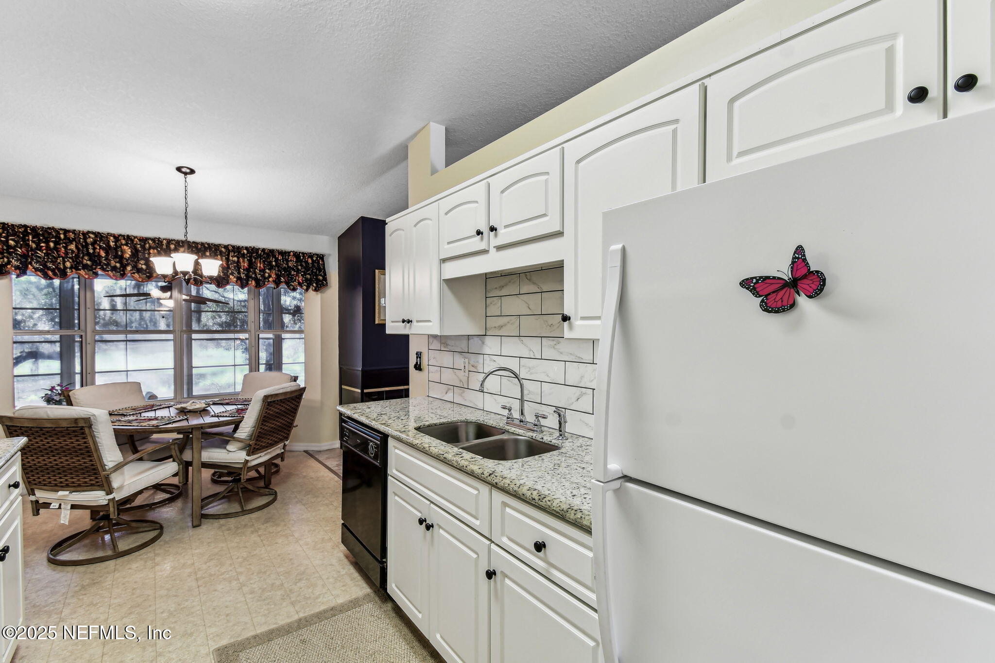 117 Gator Trail Melrose, FL 32666 - Photo 11 of 67 a kitchen with granite countertop a sink appliances and cabinets