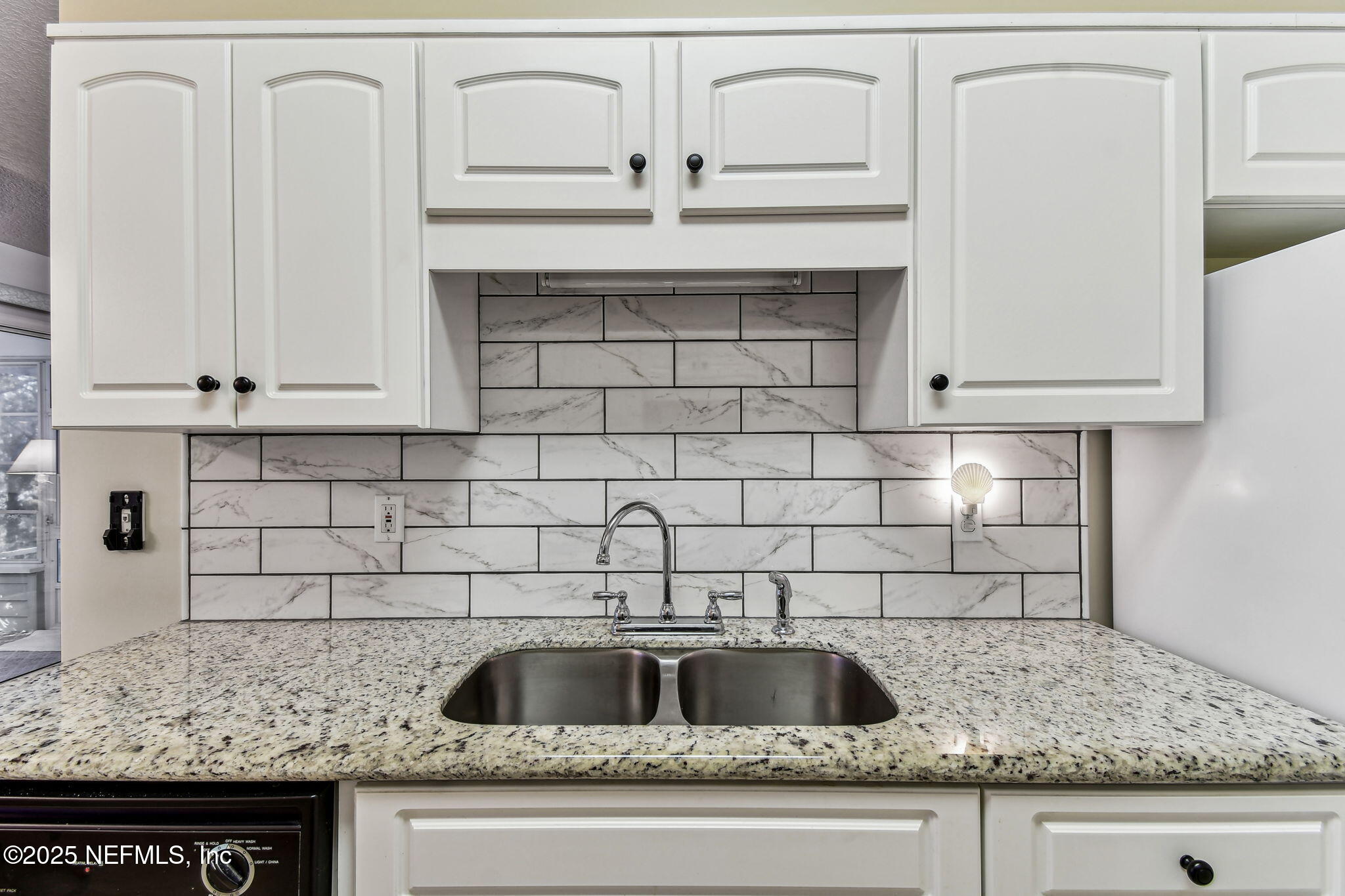 117 Gator Trail Melrose, FL 32666 - Photo 12 of 67 a kitchen with granite countertop white cabinets and a sink