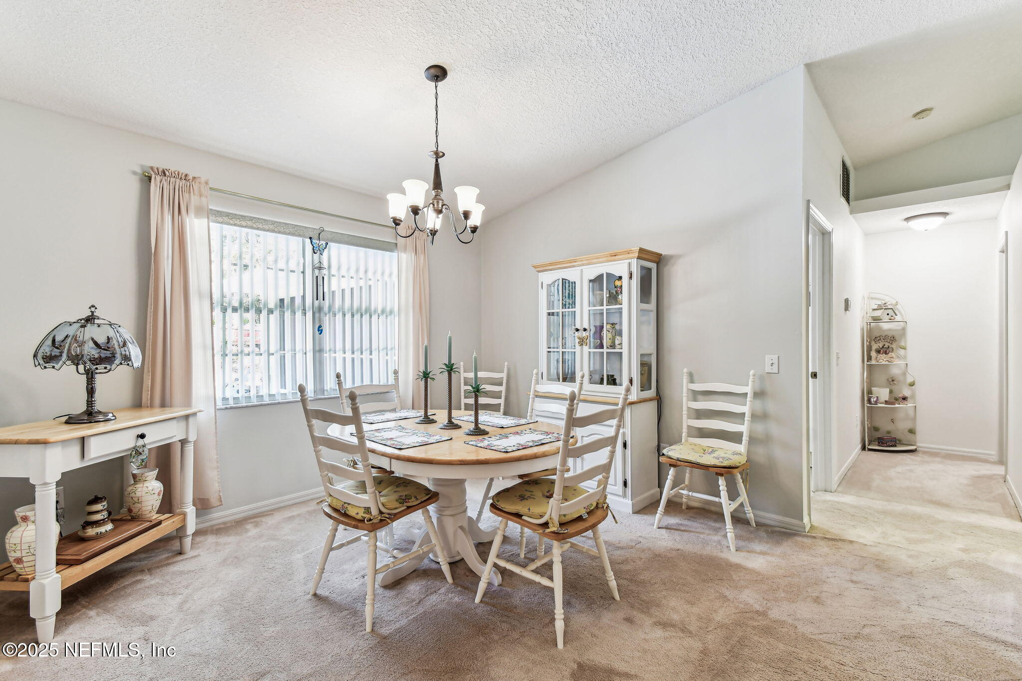 117 Gator Trail Melrose, FL 32666 - Photo 18 of 67 a view of a dining room with furniture window and wooden floor
